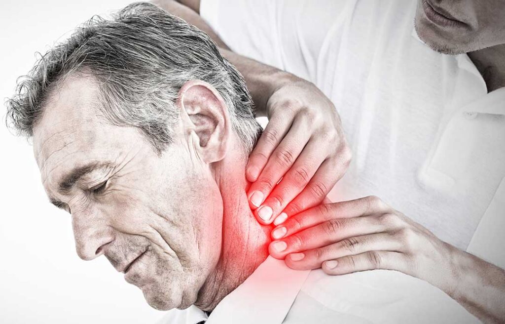 Person using a cold pack on the neck while seated at home after a car accident.